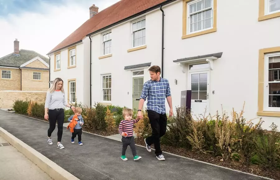 A young family walking past new homes at Park View